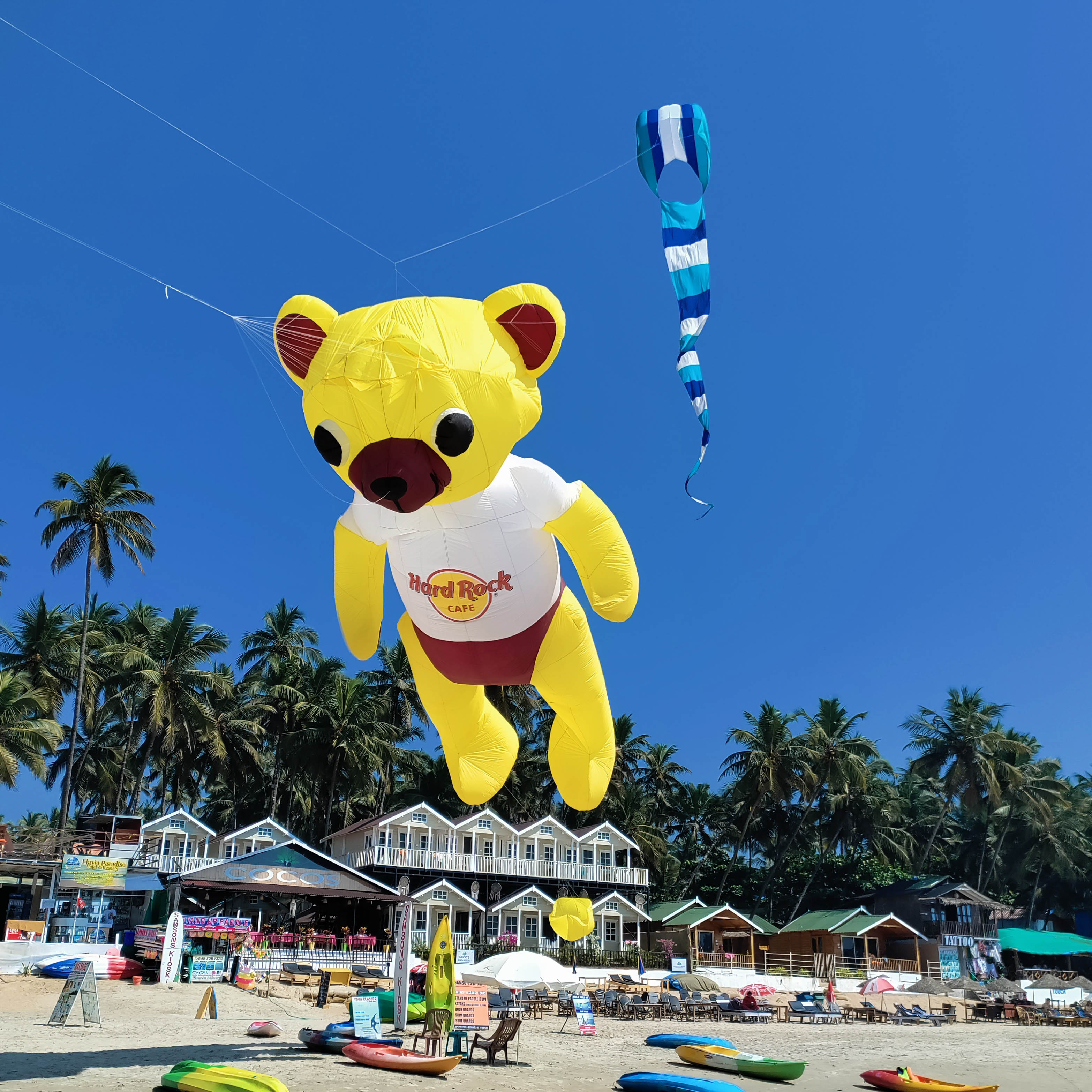 Giant character kites flying in a bright sky